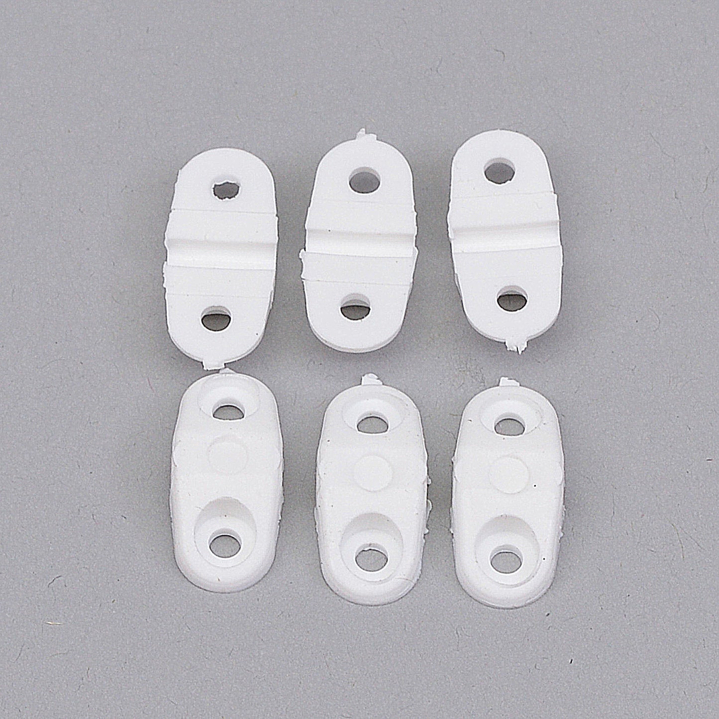 2.6mm (12 swg) Saddle Clamps 6 per pack: 2.6mm (12swg) saddle clamps, 6 per pack, providing secure attachment for small diameter components in RC planes.