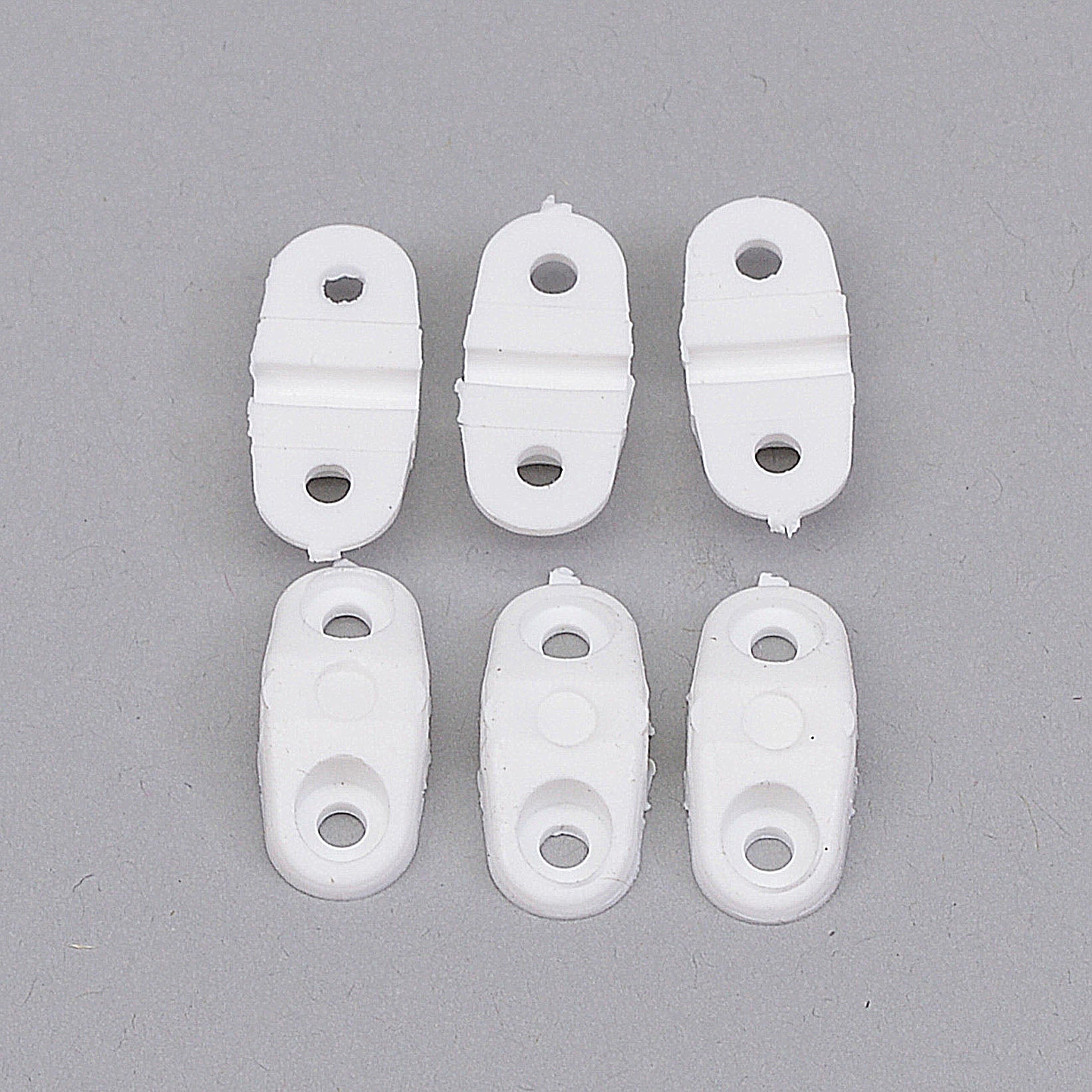 2.6mm (12 swg) Saddle Clamps 6 per pack: 2.6mm (12swg) saddle clamps, 6 per pack, providing secure attachment for small diameter components in RC planes.