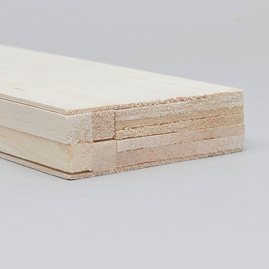 Mini balsa wood bundles for RC aircraft construction, offering lightweight and flexible material for model building.